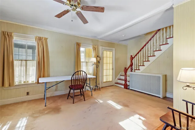 a living room with furniture and a window