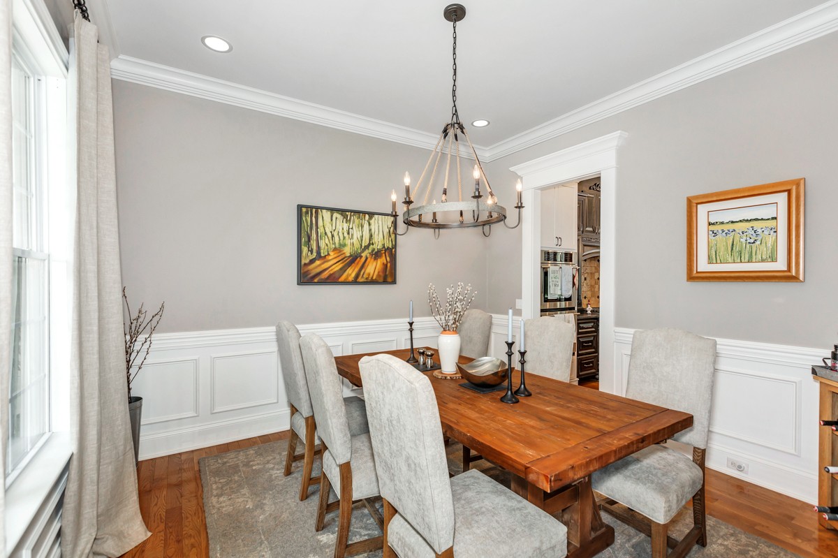 983 Veto Road Prospect, TN 38477 - Photo 13 of 43 a view of a dining room with furniture a chandelier and wooden floor