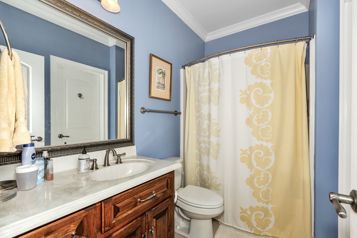 983 Veto Road Prospect, TN 38477 - Photo 20 of 43 a bathroom with a granite countertop sink and a mirror