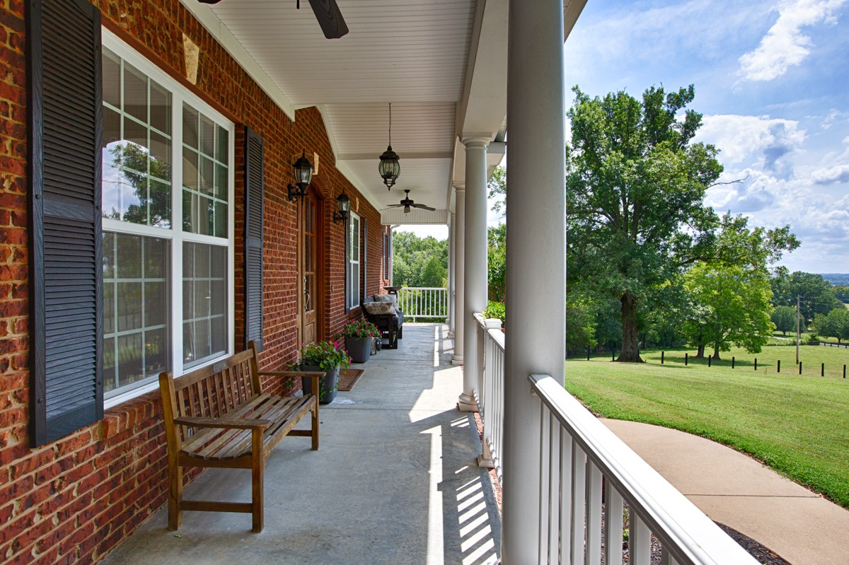 983 Veto Road Prospect, TN 38477 - Photo 3 of 43 a view of a chairs with a table in the balcony