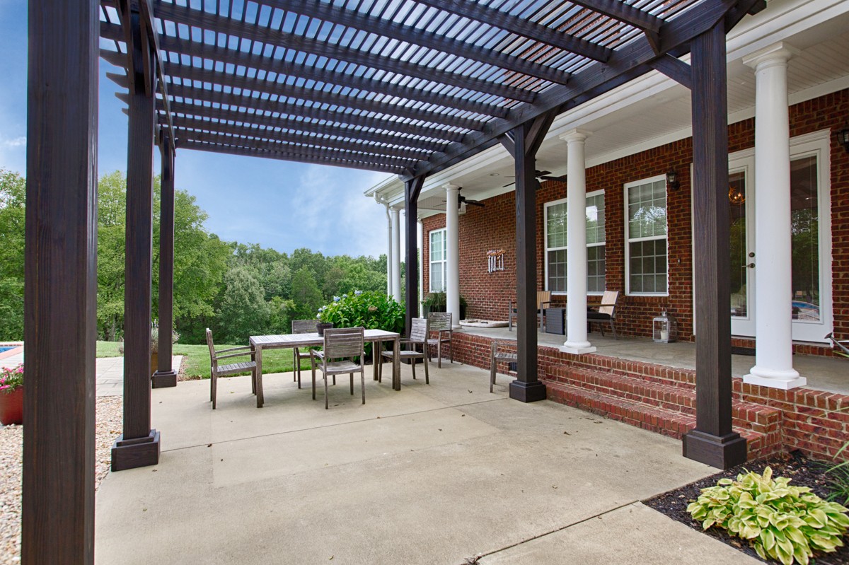 983 Veto Road Prospect, TN 38477 - Photo 31 of 43 a view of a porch with chairs and floor to ceiling window
