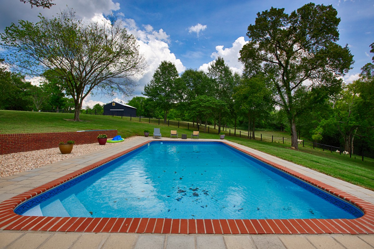 983 Veto Road Prospect, TN 38477 - Photo 33 of 43 a view of swimming pool with a backyard and trees