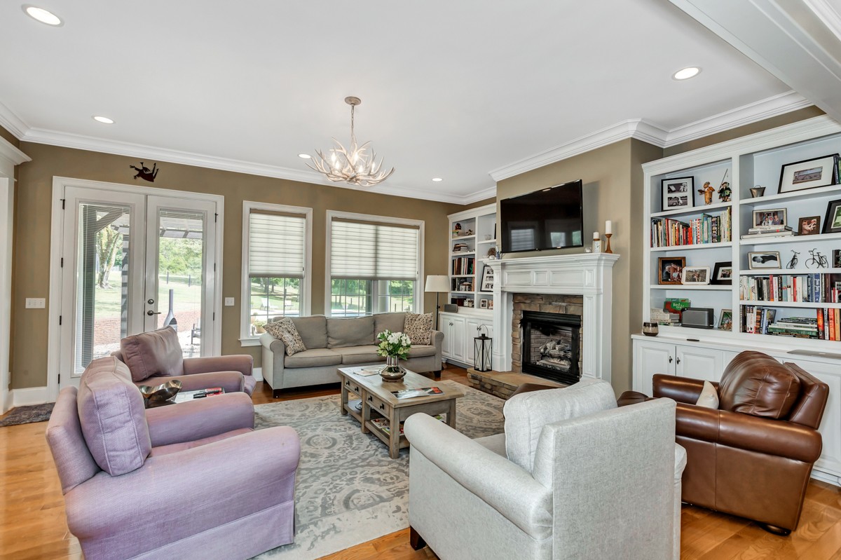 983 Veto Road Prospect, TN 38477 - Photo 6 of 43 a living room with furniture fireplace and a large window