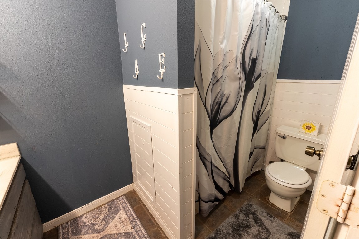 5818 Yorkgate Drive Spring, TX 77373 - Photo 11 of 19 Bright and updated full bath featuring a large vanity, open shelving, and fresh two-tone paint.