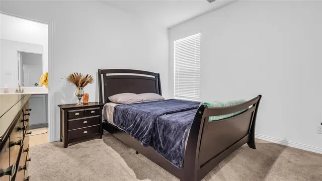 a bedroom with a bed and a cabinets