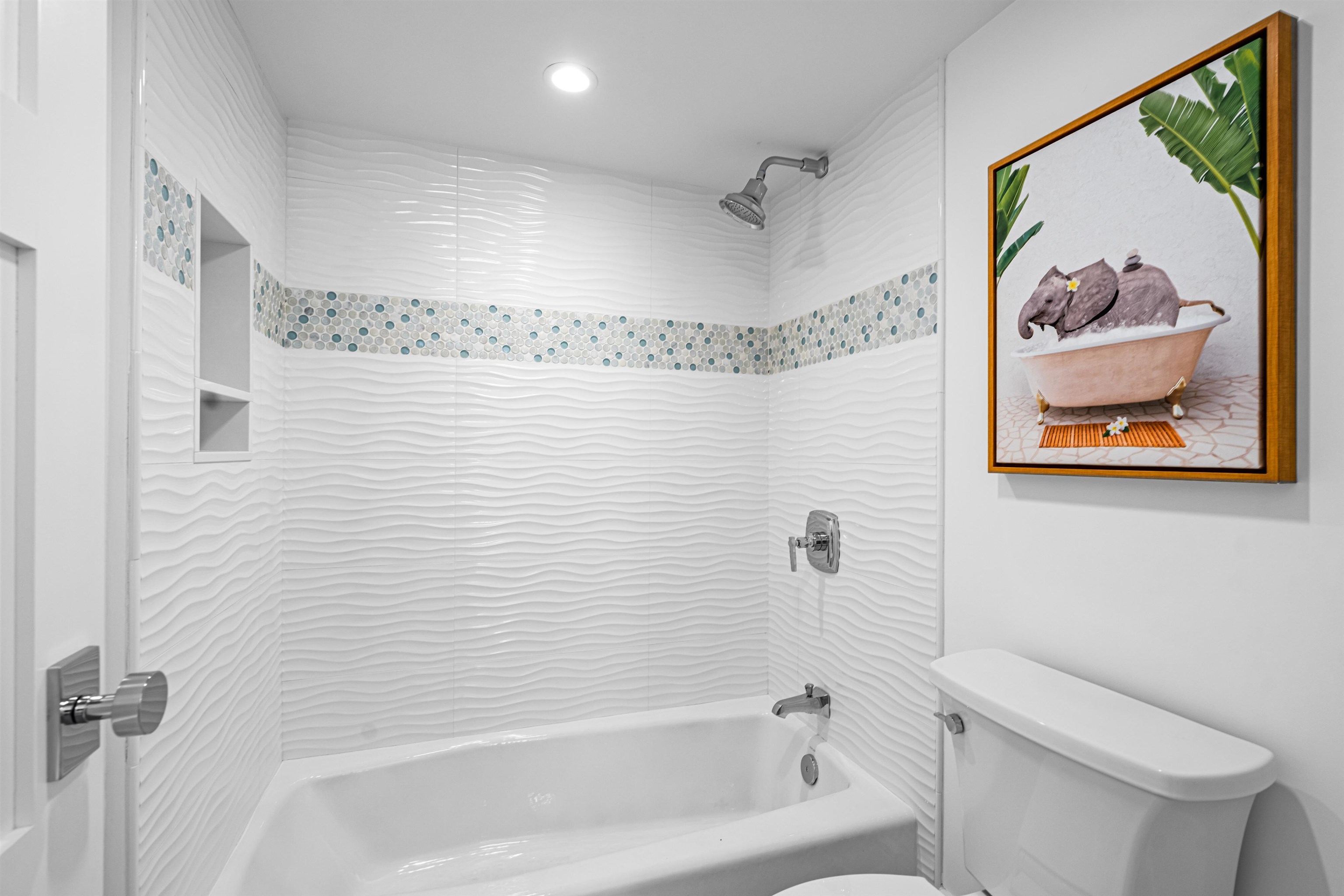 2158 Ocean Drive, Unit 2158 Avalon, NJ 08202 - Photo 13 of 50 a bathroom with a shower and a toilet