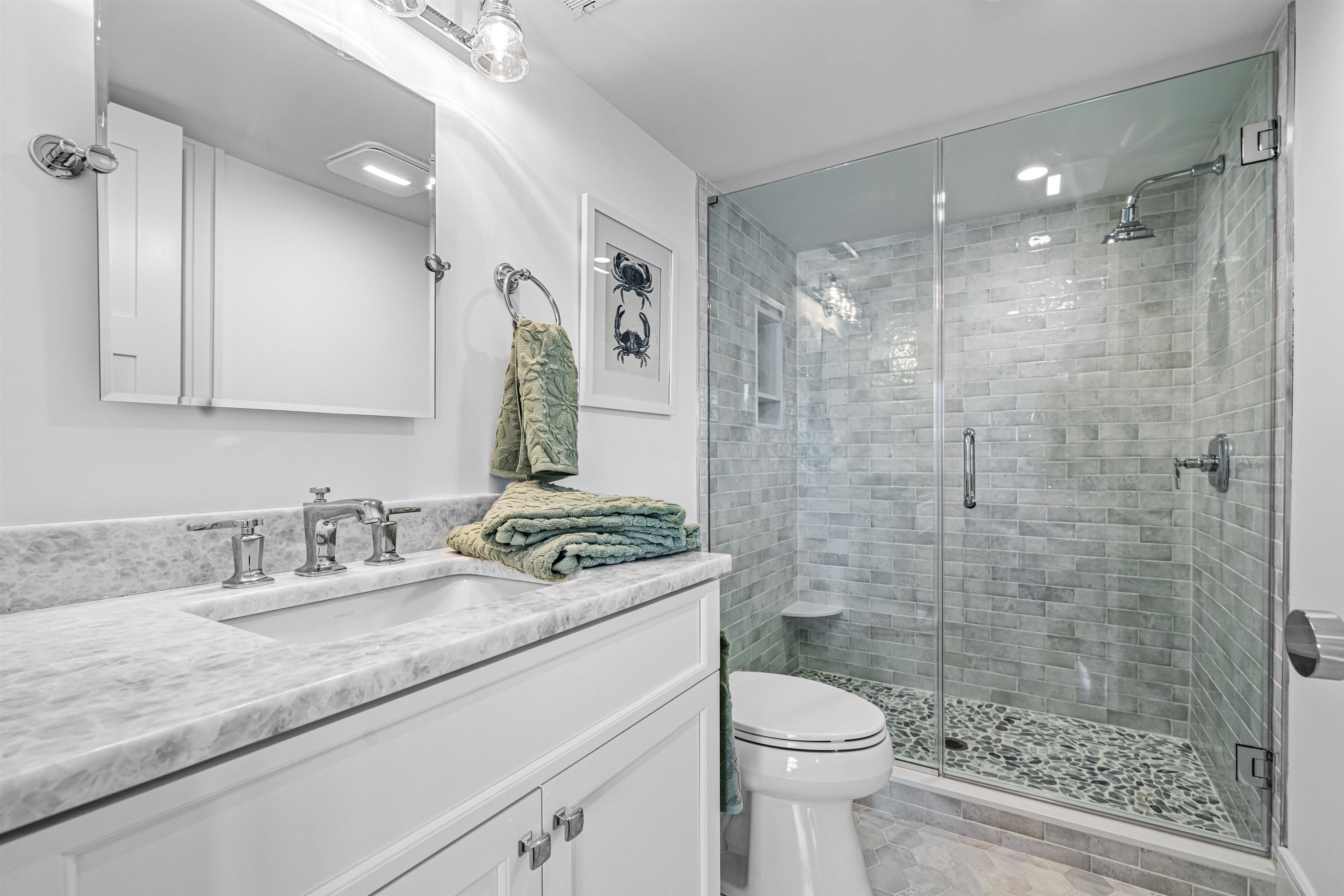 2158 Ocean Drive, Unit 2158 Avalon, NJ 08202 - Photo 16 of 50 a bathroom with a sink a toilet and shower
