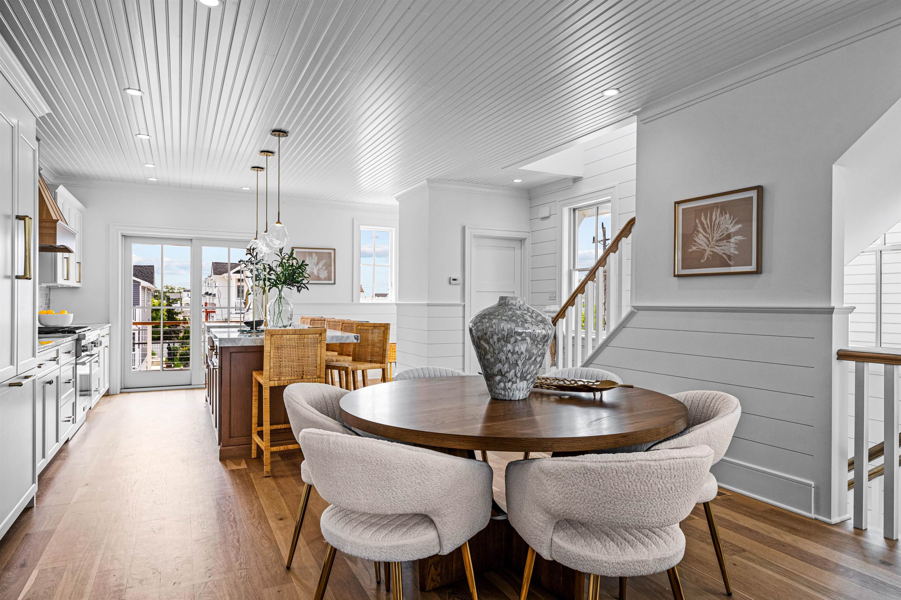 2158 Ocean Drive, Unit 2158 Avalon, NJ 08202 - Photo 18 of 50 a dining room with furniture a chandelier and wooden floor