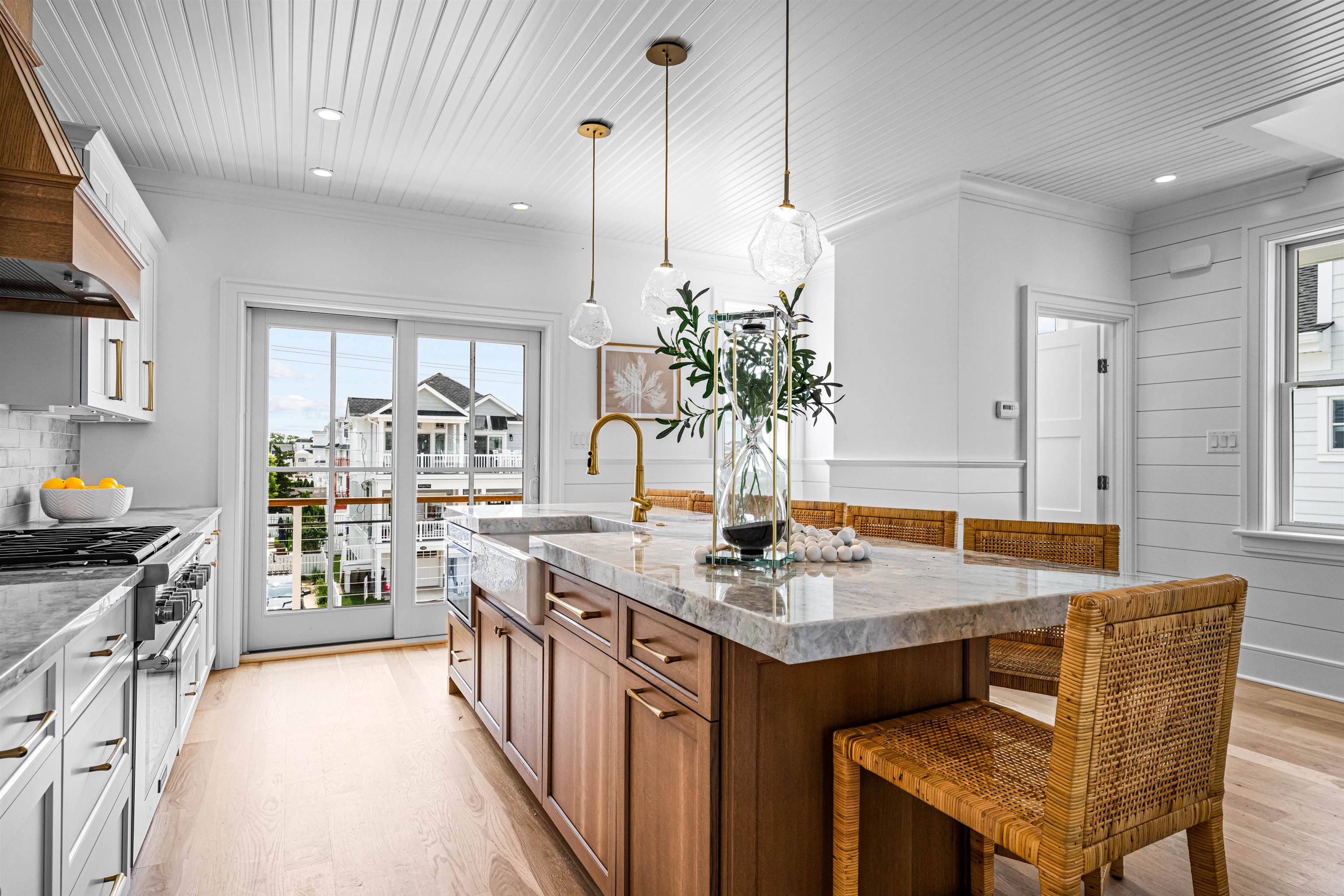 2158 Ocean Drive, Unit 2158 Avalon, NJ 08202 - Photo 19 of 50 a kitchen with stainless steel appliances kitchen island granite countertop a stove a sink and a refrigerator