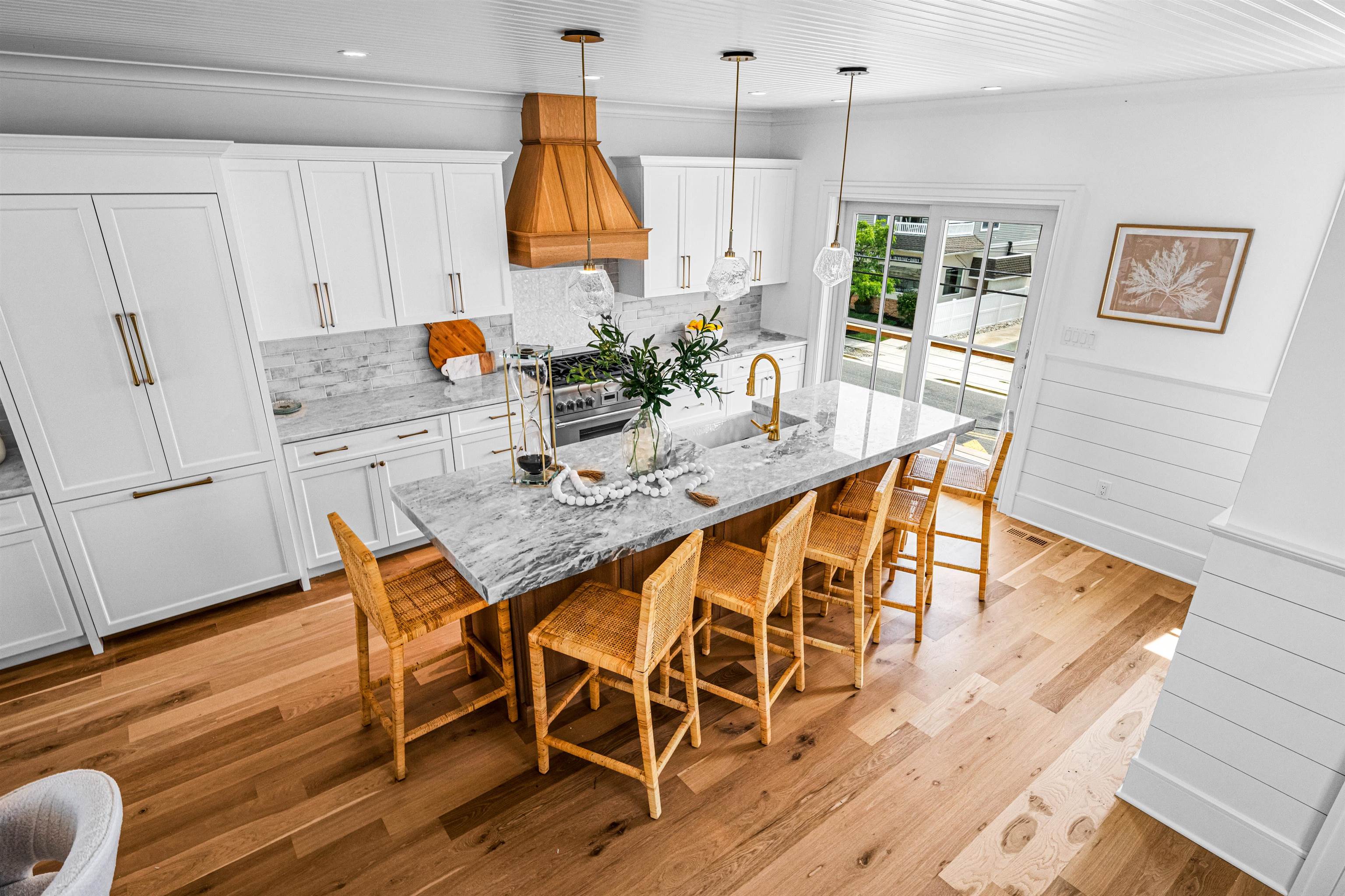 2158 Ocean Drive, Unit 2158 Avalon, NJ 08202 - Photo 21 of 50 a dining room dining table chairs wooden floor and a view of kitchen