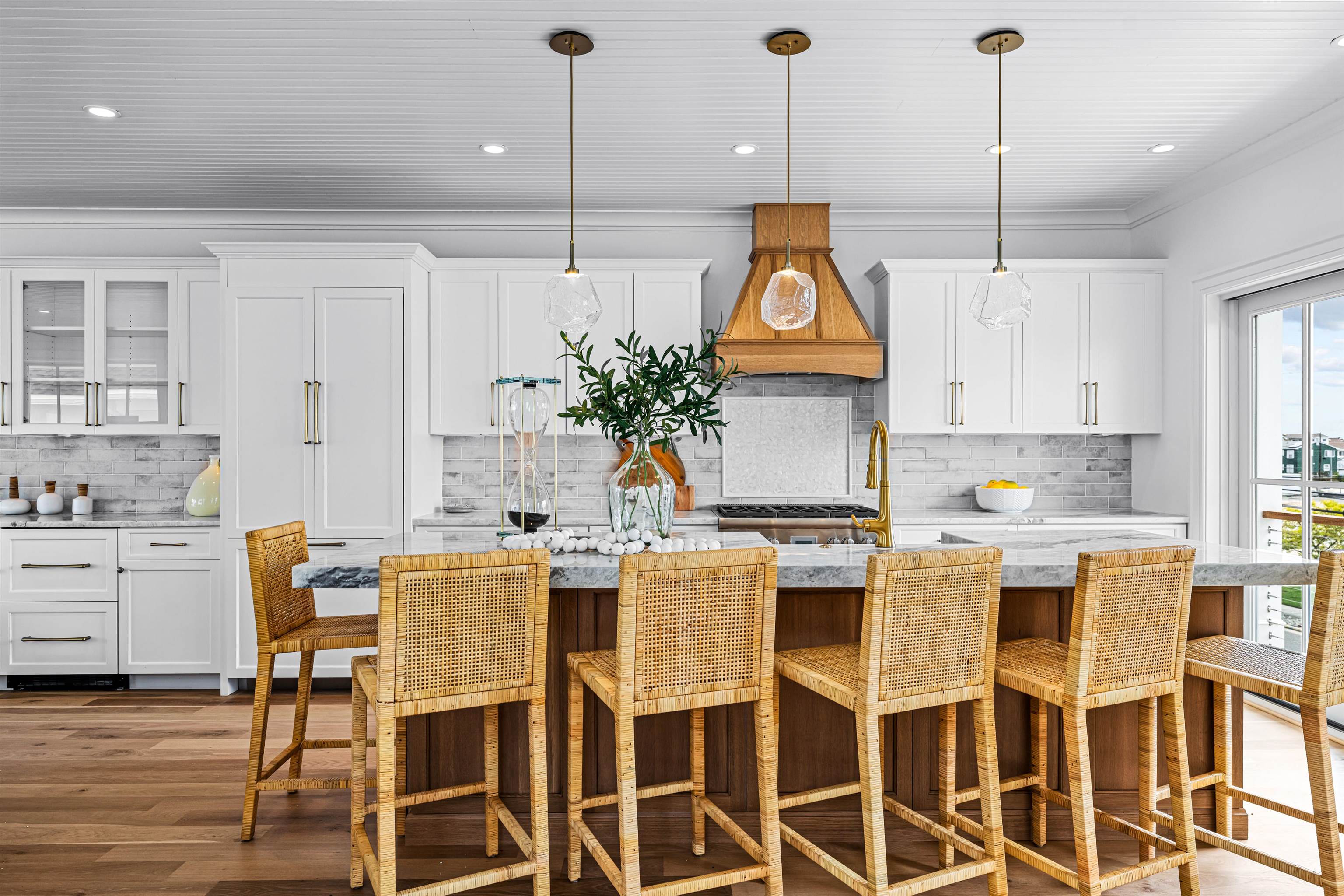 2158 Ocean Drive, Unit 2158 Avalon, NJ 08202 - Photo 23 of 50 a kitchen with stainless steel appliances kitchen island granite countertop a table chairs and white cabinets
