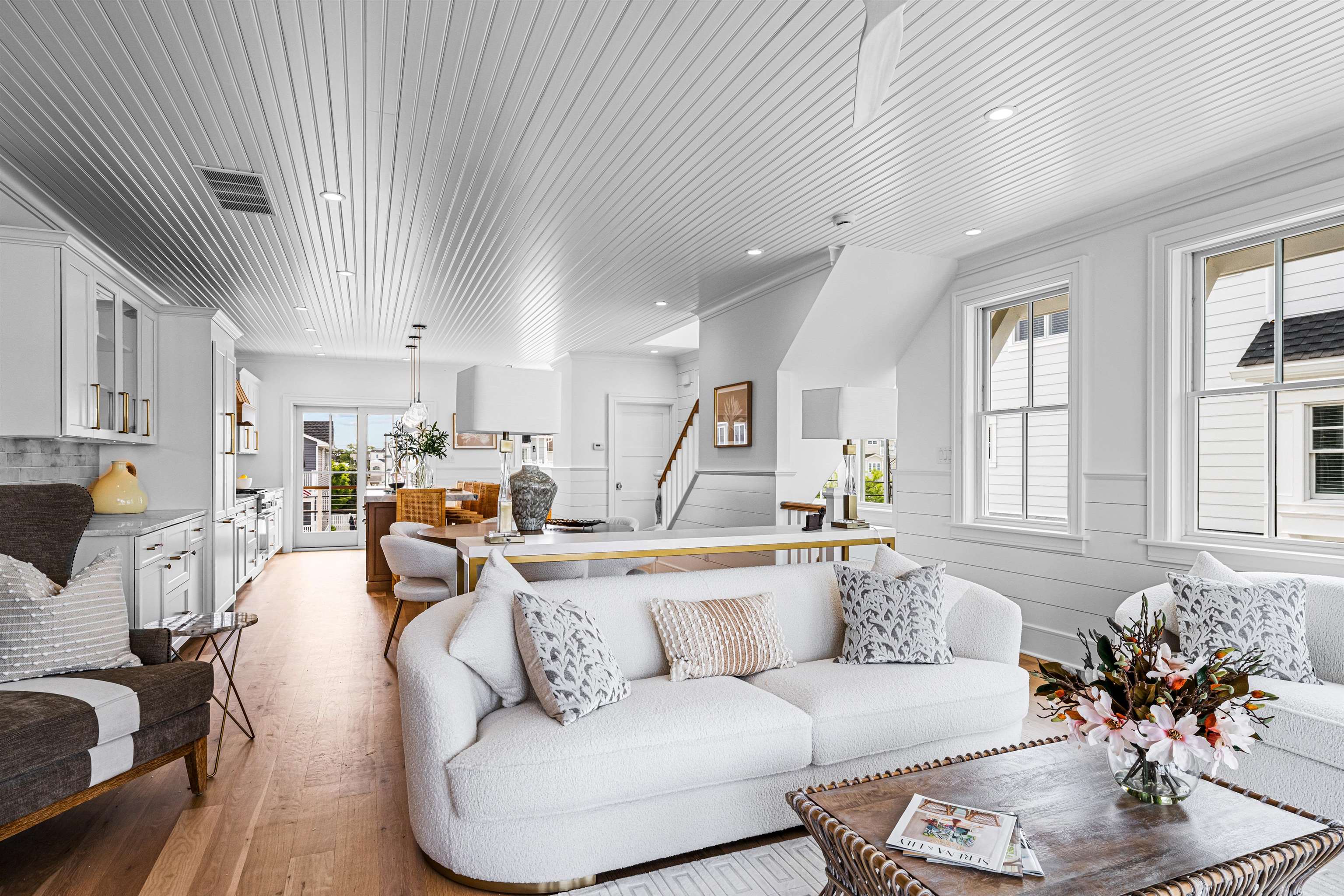 2158 Ocean Drive, Unit 2158 Avalon, NJ 08202 - Photo 30 of 50 a living room with furniture kitchen and a chandelier