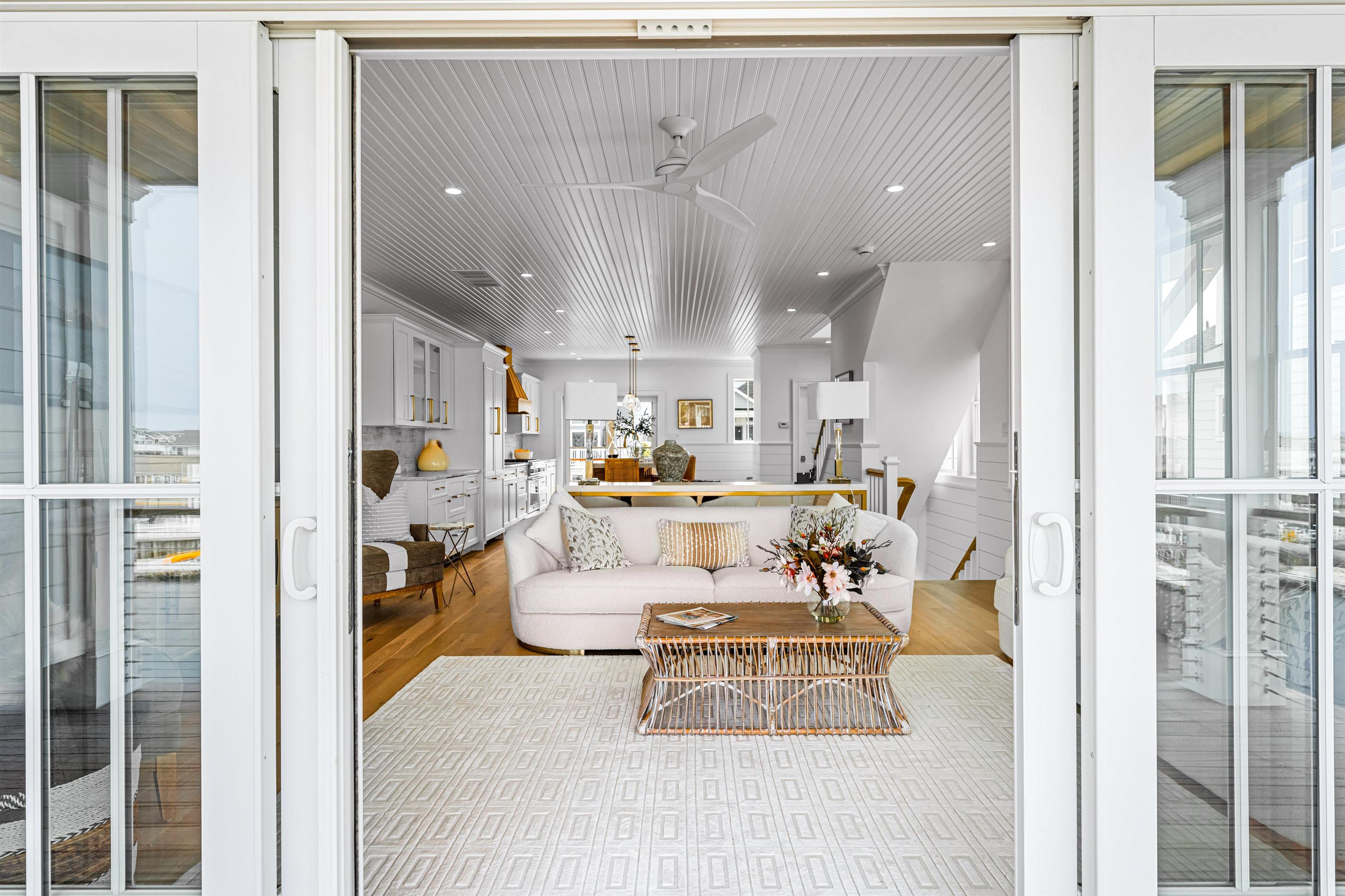 2158 Ocean Drive, Unit 2158 Avalon, NJ 08202 - Photo 32 of 50 a living room with furniture and a dining table next to a window