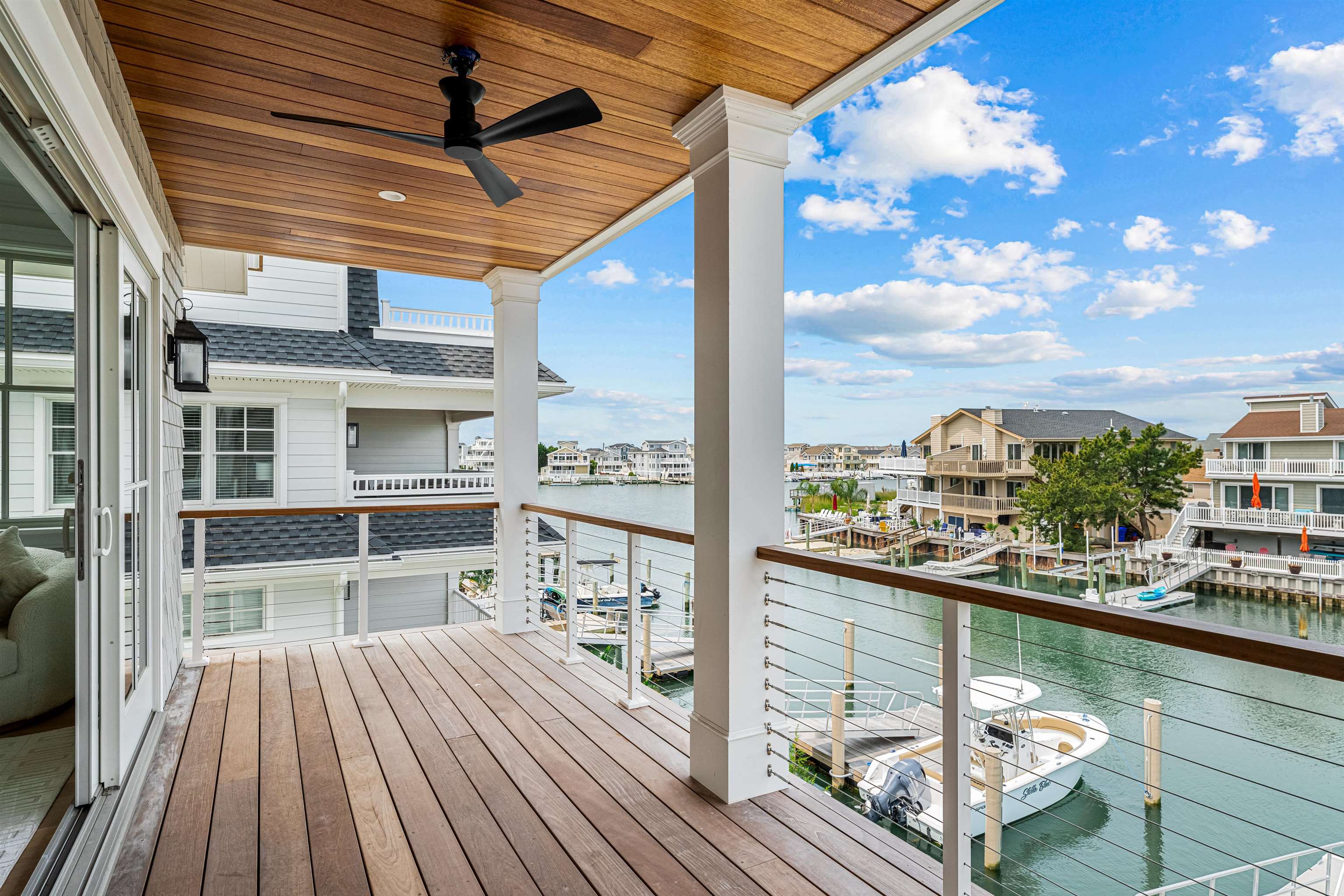 2158 Ocean Drive, Unit 2158 Avalon, NJ 08202 - Photo 33 of 50 a view of a balcony with wooden floor