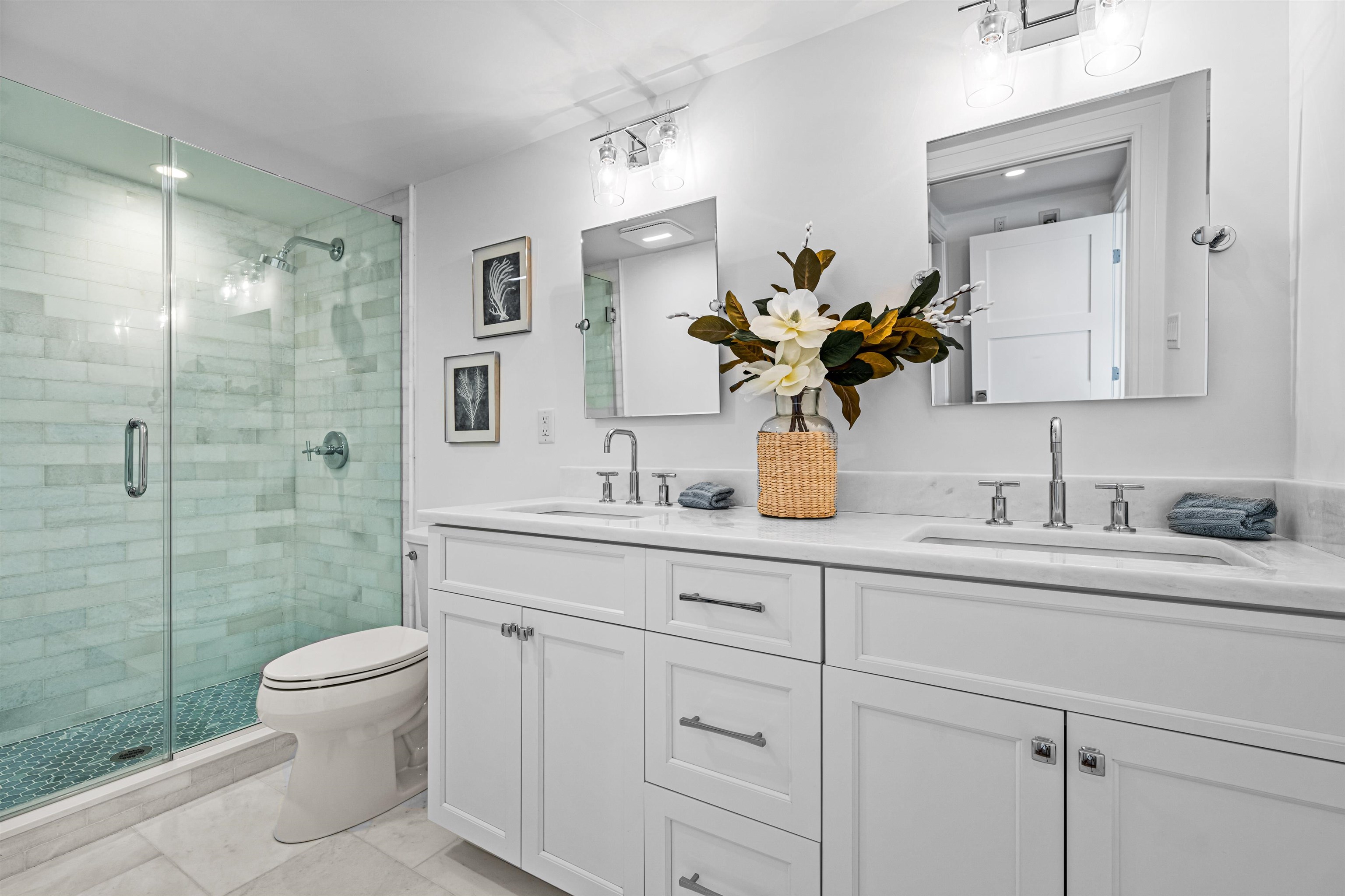 2158 Ocean Drive, Unit 2158 Avalon, NJ 08202 - Photo 38 of 50 a bathroom with a granite countertop sink a toilet and a mirror