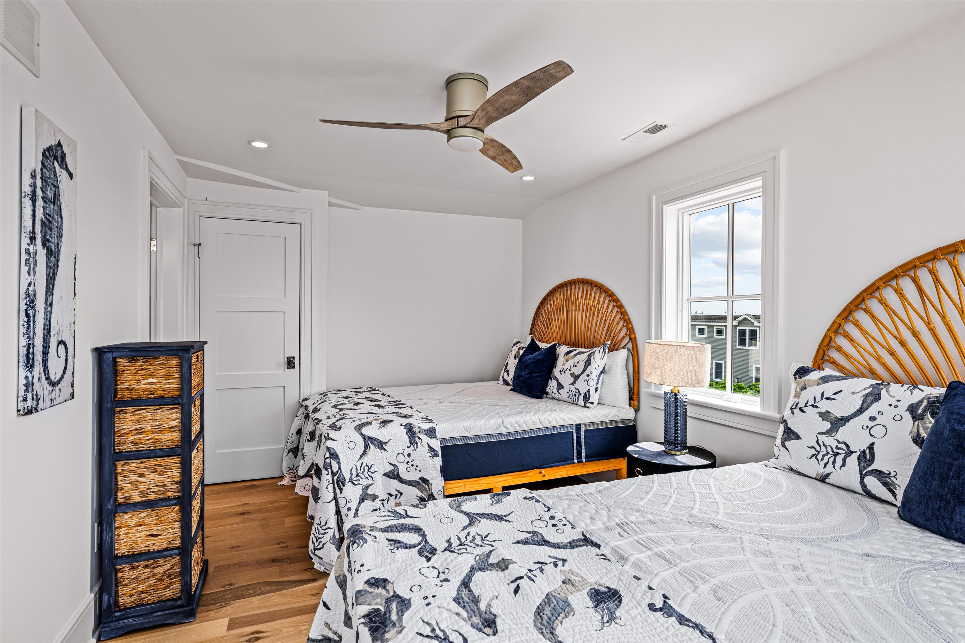 2158 Ocean Drive, Unit 2158 Avalon, NJ 08202 - Photo 40 of 50 a bedroom with a bed and a window