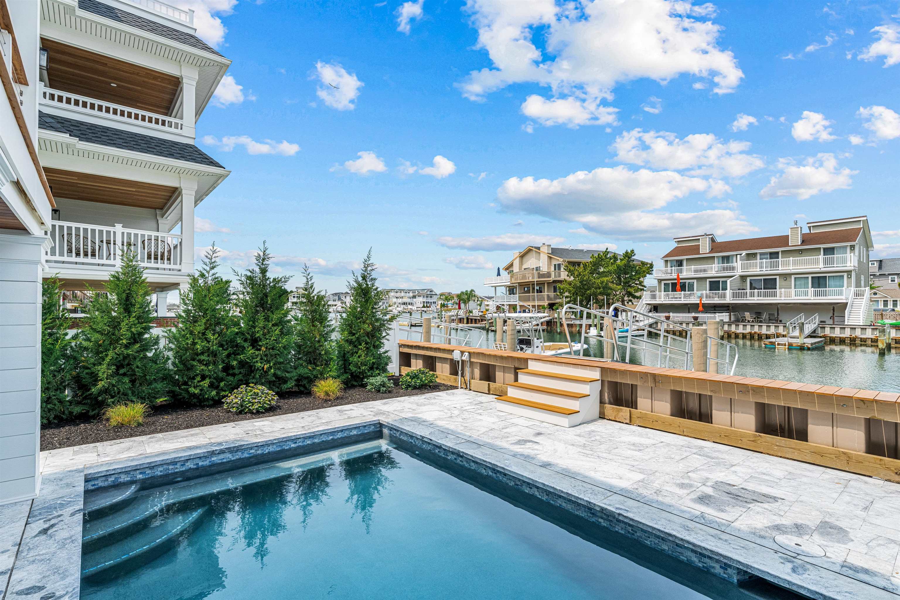 2158 Ocean Drive, Unit 2158 Avalon, NJ 08202 - Photo 46 of 50 a view of houses with a swimming pool
