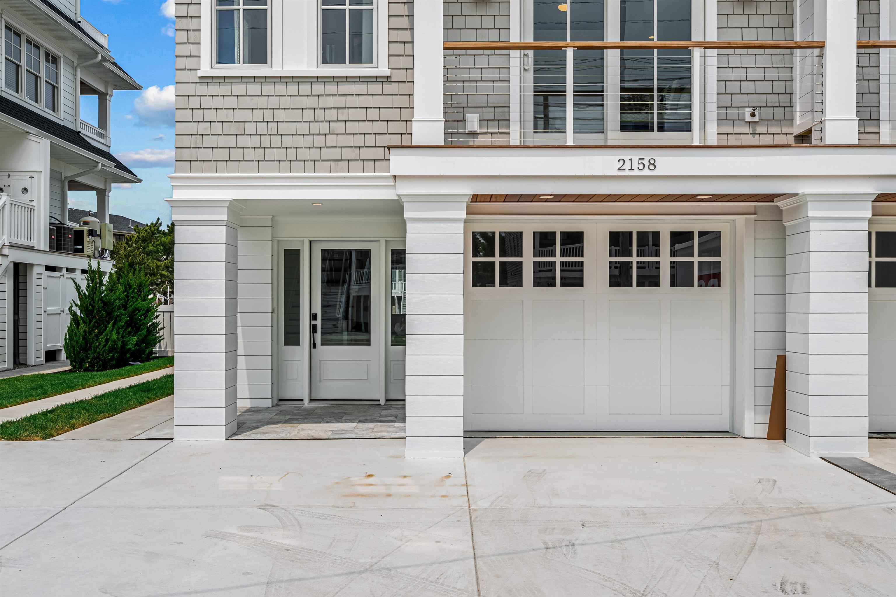 2158 Ocean Drive, Unit 2158 Avalon, NJ 08202 - Photo 5 of 50 a view of a building with a yard and large windows