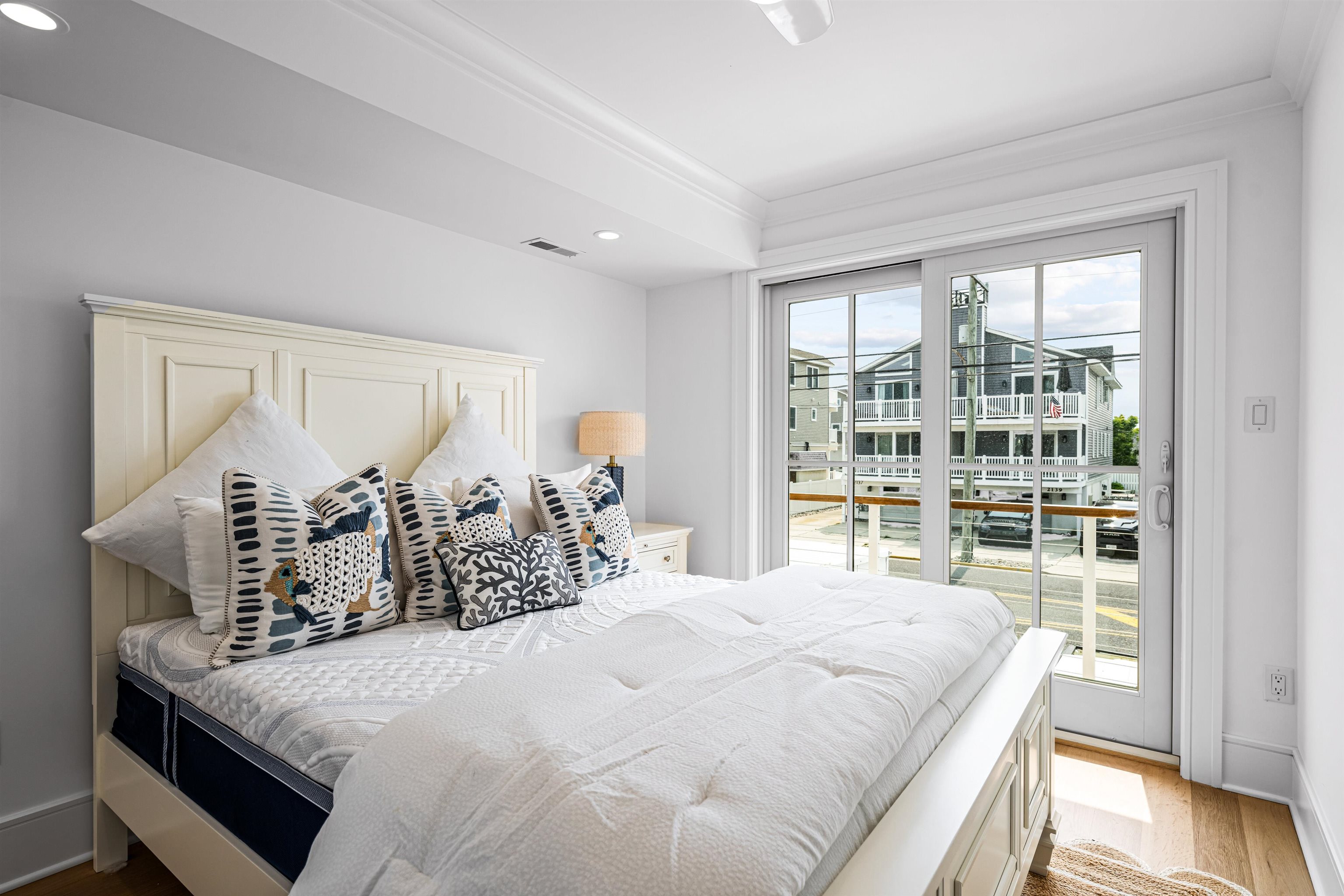 2158 Ocean Drive, Unit 2158 Avalon, NJ 08202 - Photo 10 of 50 a bedroom with a large bed and a large window