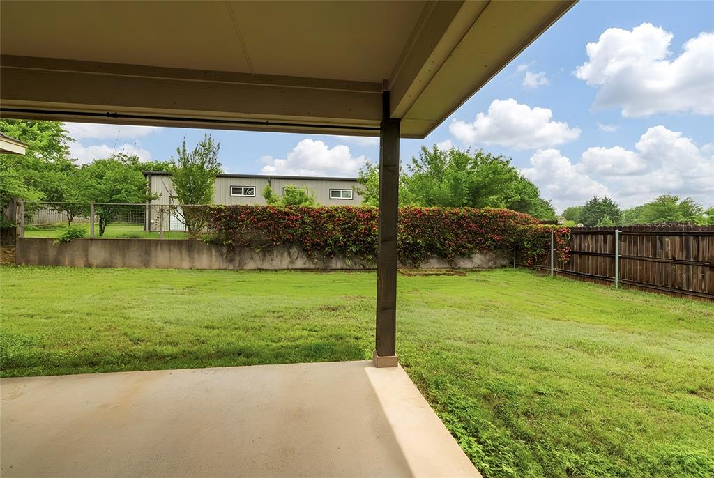 405 Kimbrough Road Azle, TX 76020 - Photo 27 of 39 a view of a backyard with a garden