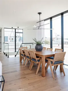 a dining room with furniture window wooden floor