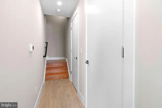 a view of a hallway with stairs