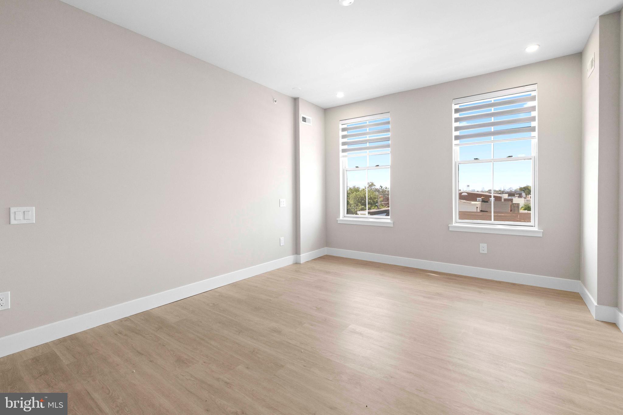 4720 Richmond Street, Unit 4 Philadelphia, PA 19137 - Photo 15 of 26 an empty room with windows