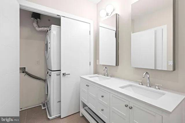 a bathroom with a double vanity sink mirror and double
