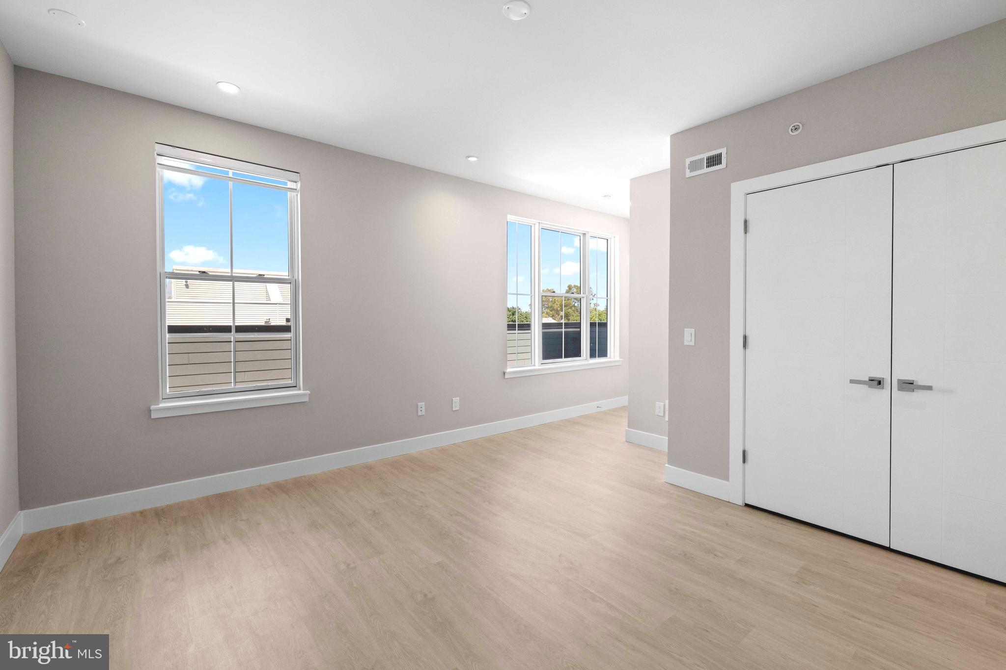 4720 Richmond Street, Unit 4 Philadelphia, PA 19137 - Photo 20 of 26 a view of an empty room with wooden floor and a window