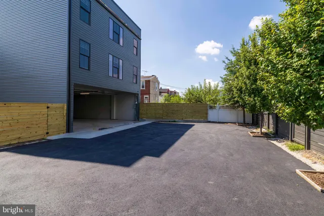 a view of a street with a building in the background