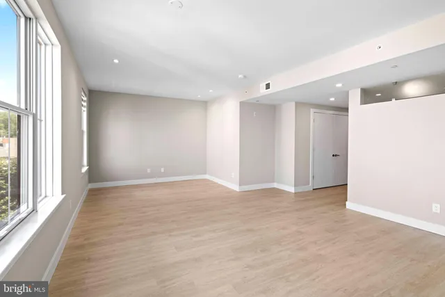 a view of an empty room with a window