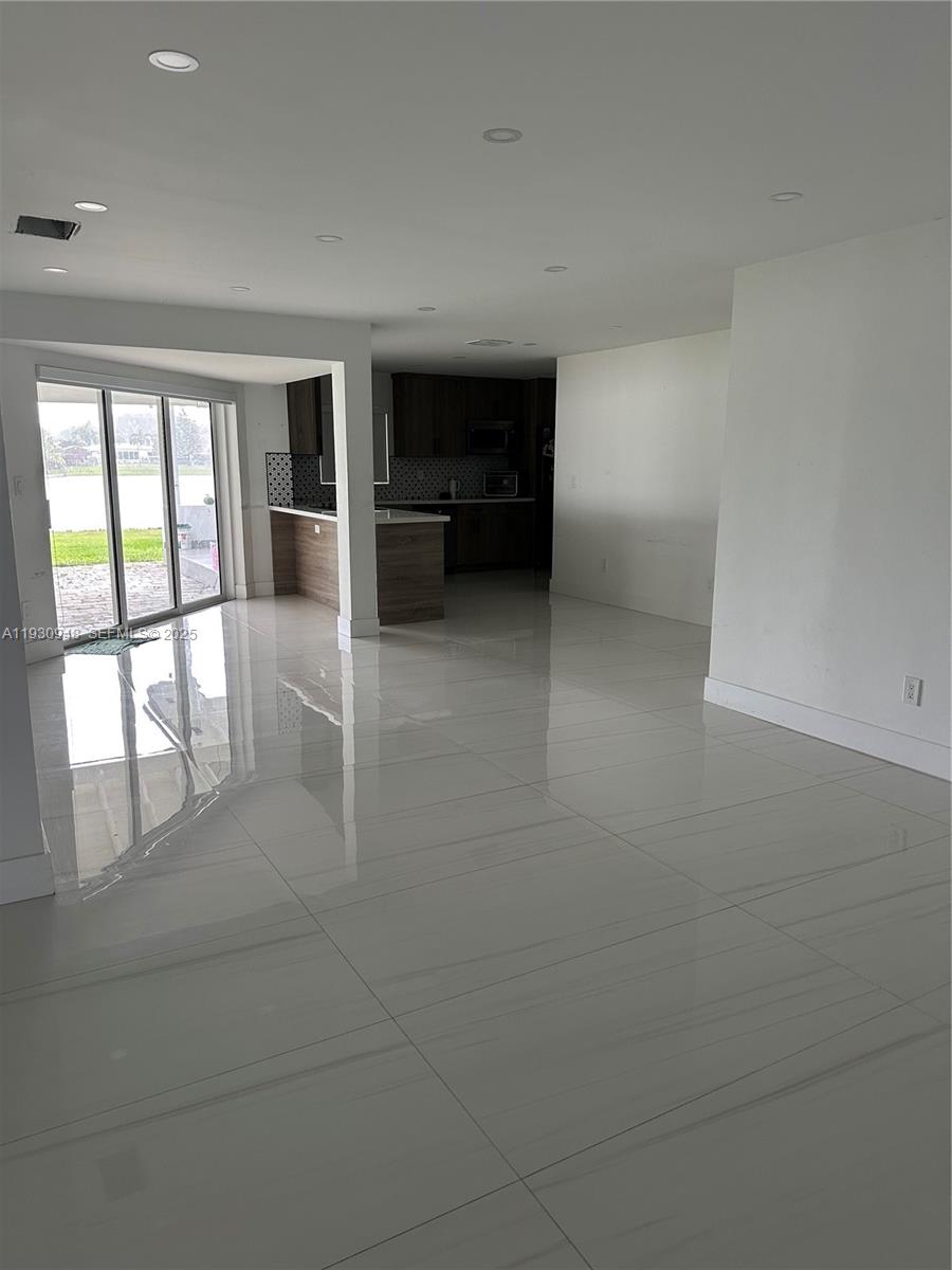 14830 Harding Lane Homestead, FL 33033 - Photo 2 of 12 a view of an empty room with a window