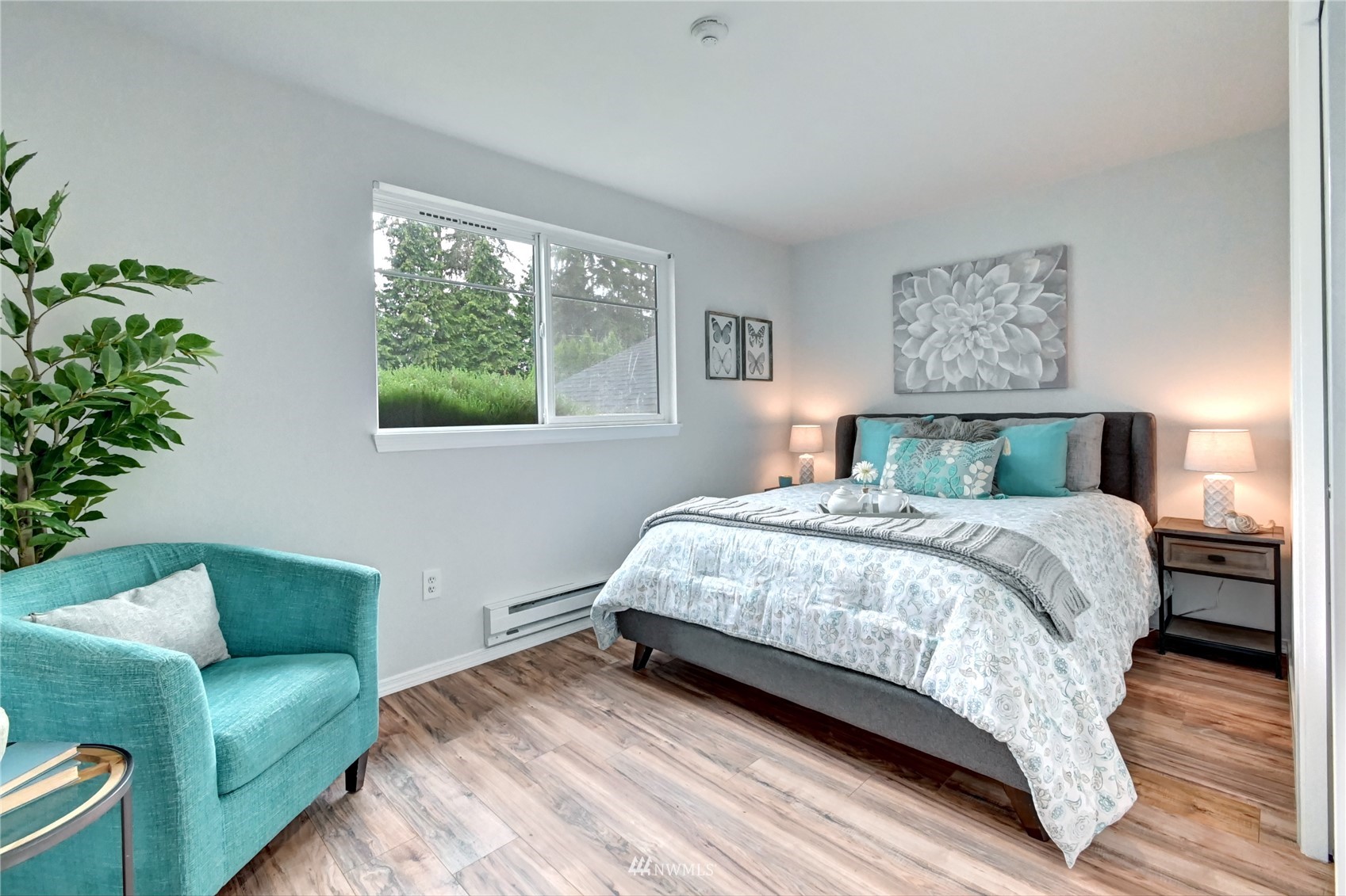 23908 Bothell Everett Highway, Unit B101 Bothell, WA 98021 - Photo 21 of 29 a bedroom with a bed wooden floor and window