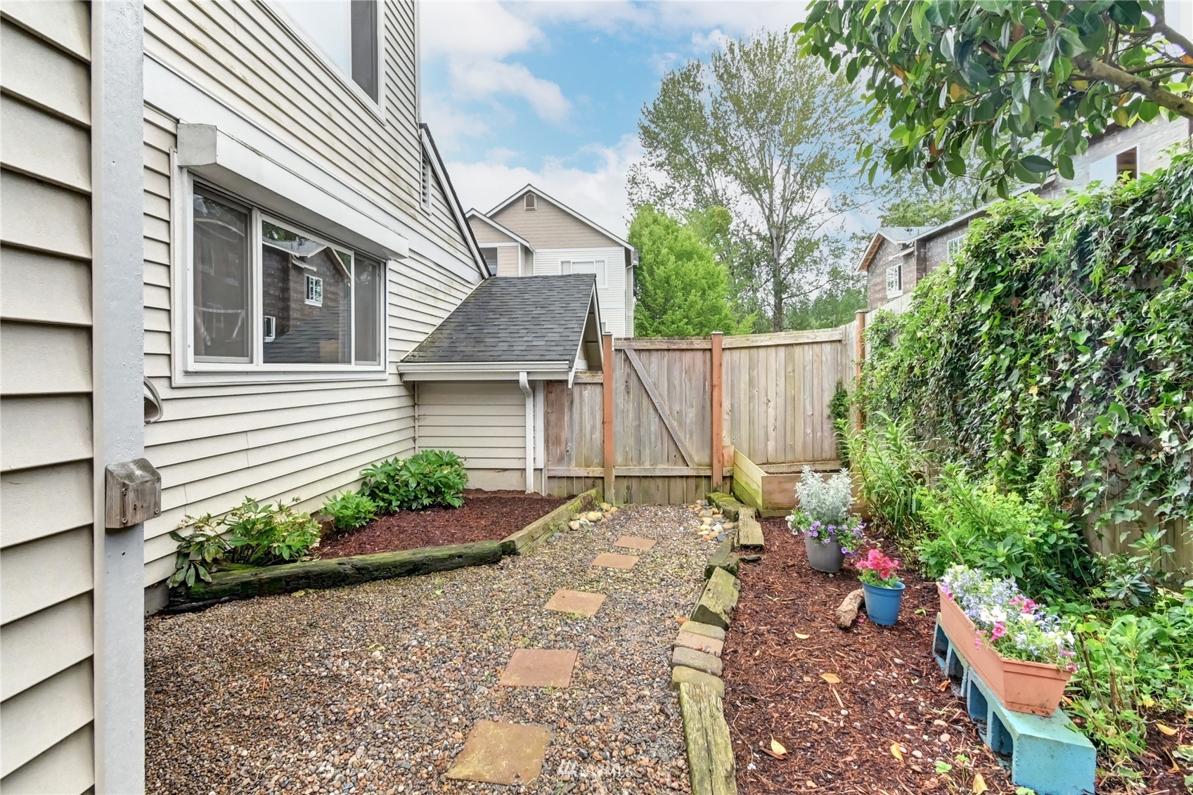 23908 Bothell Everett Highway, Unit B101 Bothell, WA 98021 - Photo 26 of 29 a view of a house with a yard