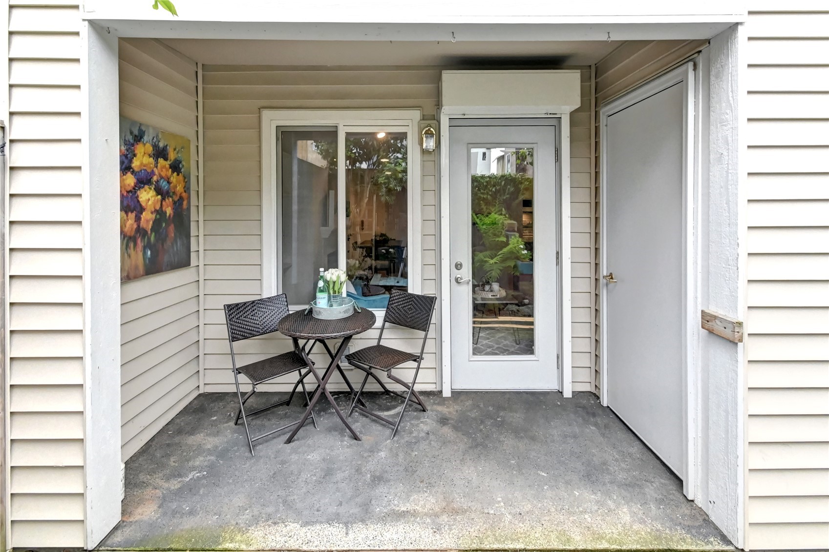 23908 Bothell Everett Highway, Unit B101 Bothell, WA 98021 - Photo 29 of 29 a view of a patio with table and chairs and potted plants