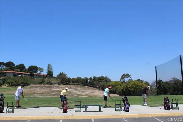 a view of a street with potted plants