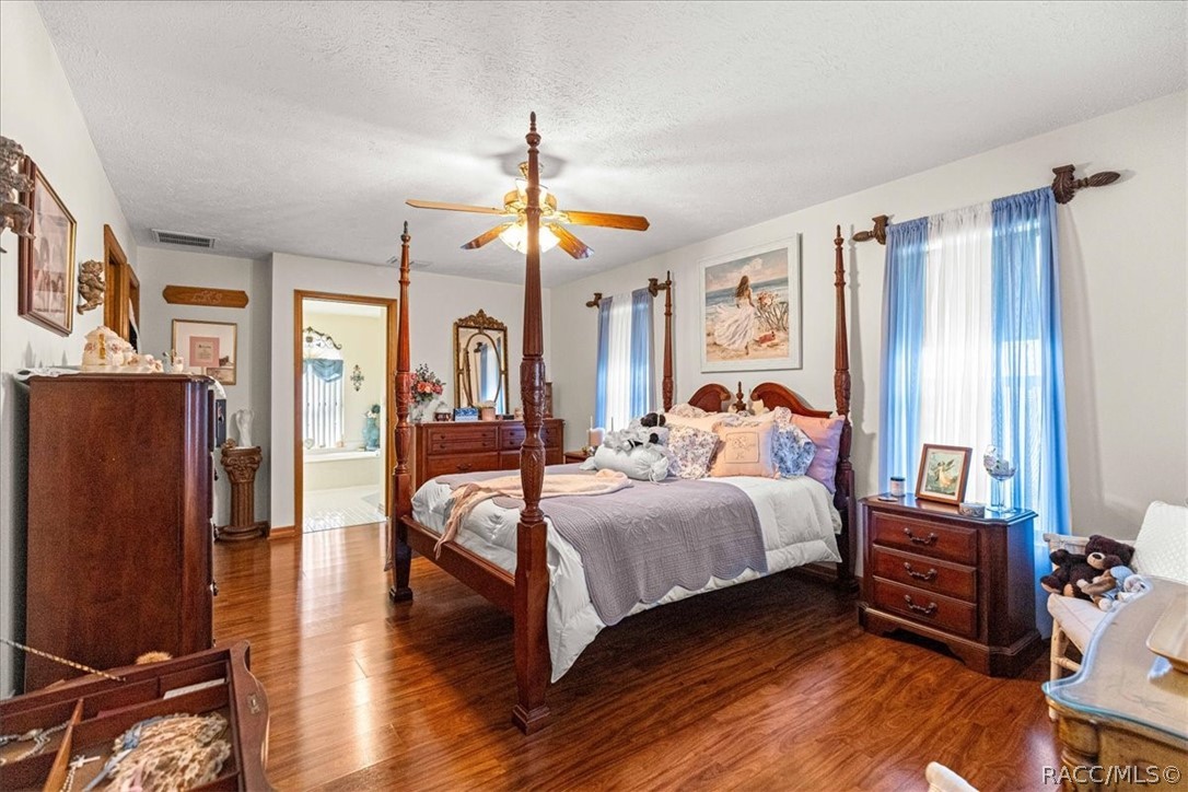 2964 South Cygnet Terrace Inverness, FL 34450 - Photo 24 of 67 a bedroom with a bed and wooden floor