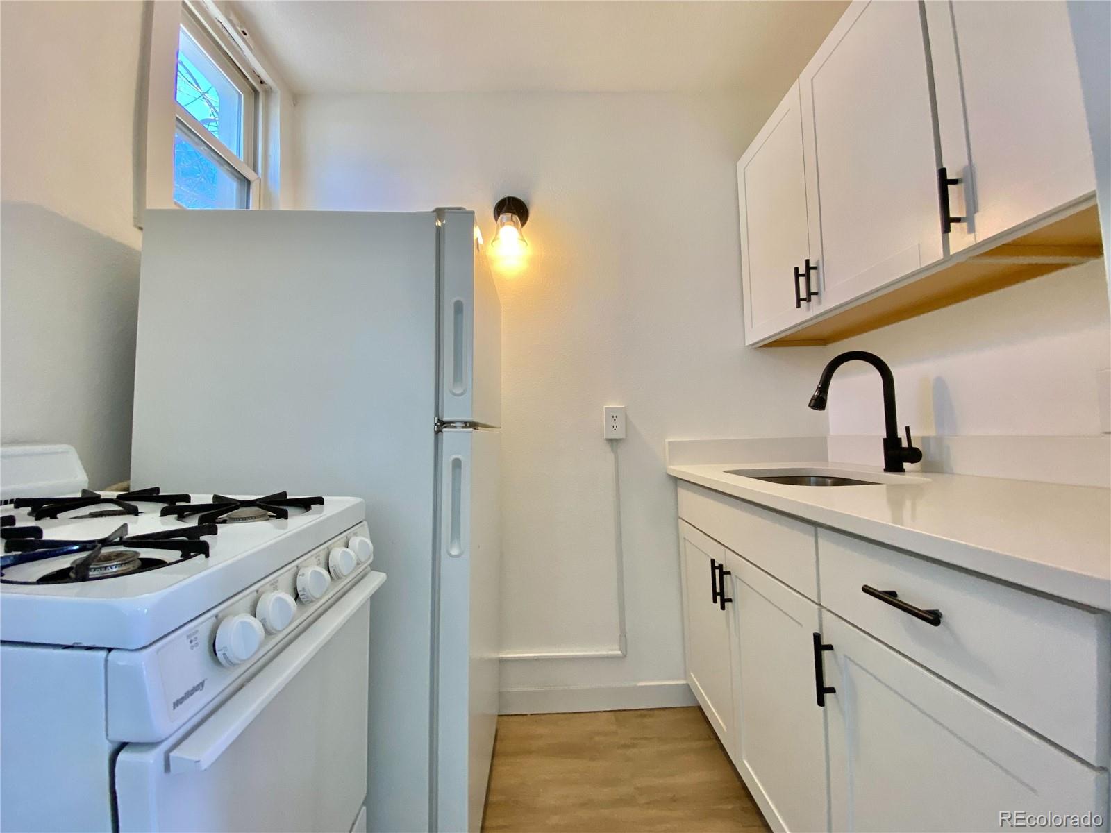 2422 West Vermijo Avenue, Unit 7 Colorado Springs, CO 80904 - Photo 2 of 6 a close view of sink and tap