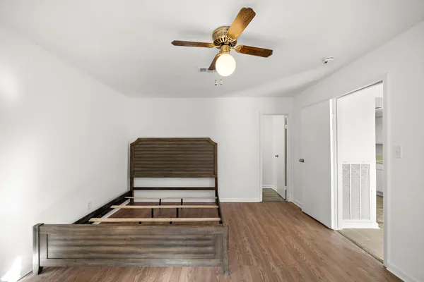 a room with closet and ceiling fan