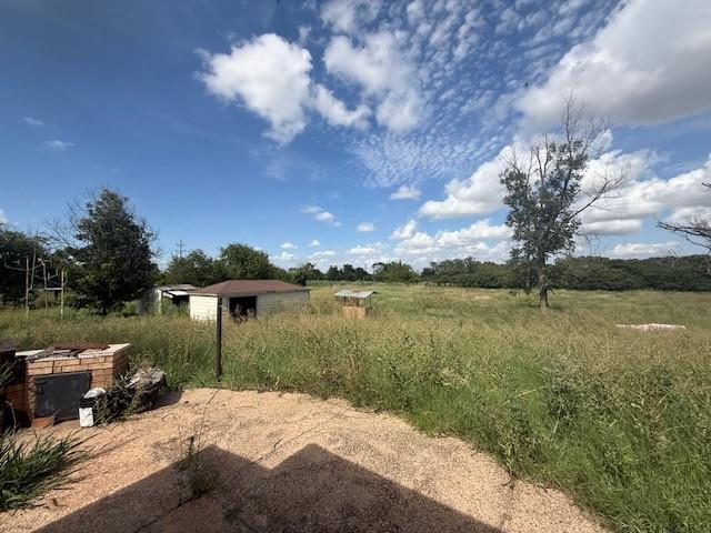 909 Railroad Street Rochester, TX 79544 - Photo 19 of 19 a view of a lake with a garden