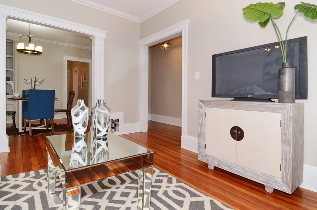 19 Rill Street, Unit 2 Boston, MA 02125 - Photo 2 of 19 a living room with furniture and flat screen tv