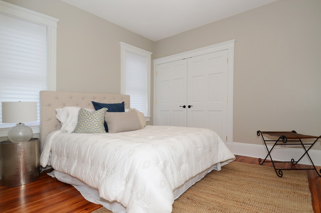 19 Rill Street, Unit 2 Boston, MA 02125 - Photo 10 of 19 a bedroom with a bed and a desk