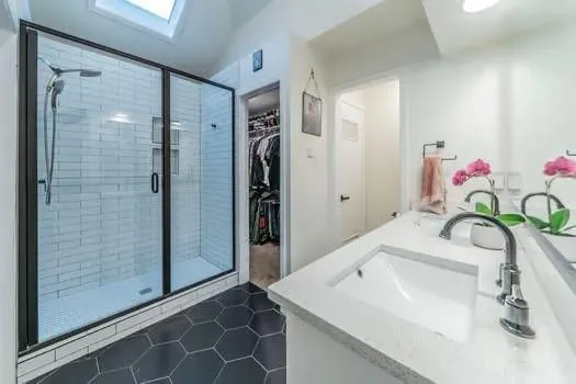 a bathroom with a sink and a shower