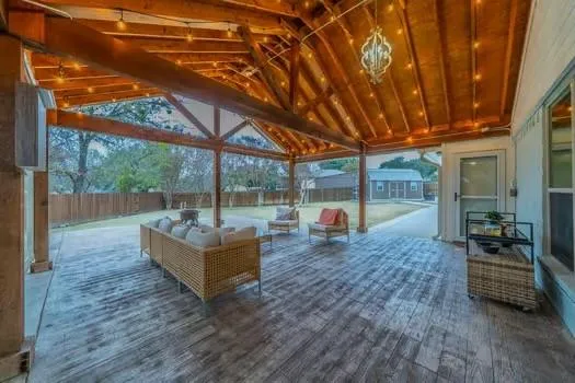 a living room with couch and wooden floor