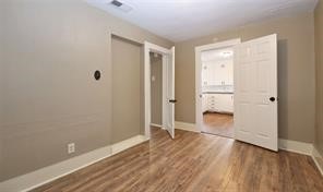 2527 Oakcliff Street Houston, TX 77023 - Photo 8 of 15 wooden floor in an empty room