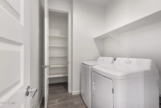 a view of a white house with large windows