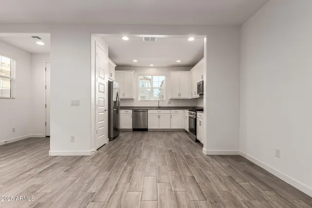 a view of kitchen with wooden floor