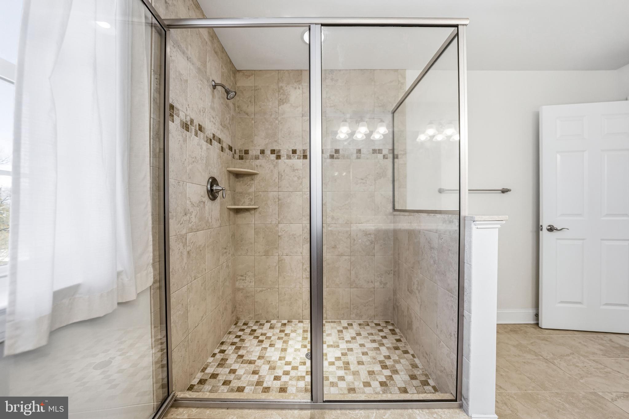 4777 Old Easton Road Doylestown, PA 18902 - Photo 16 of 26 a bathroom with a glass shower door