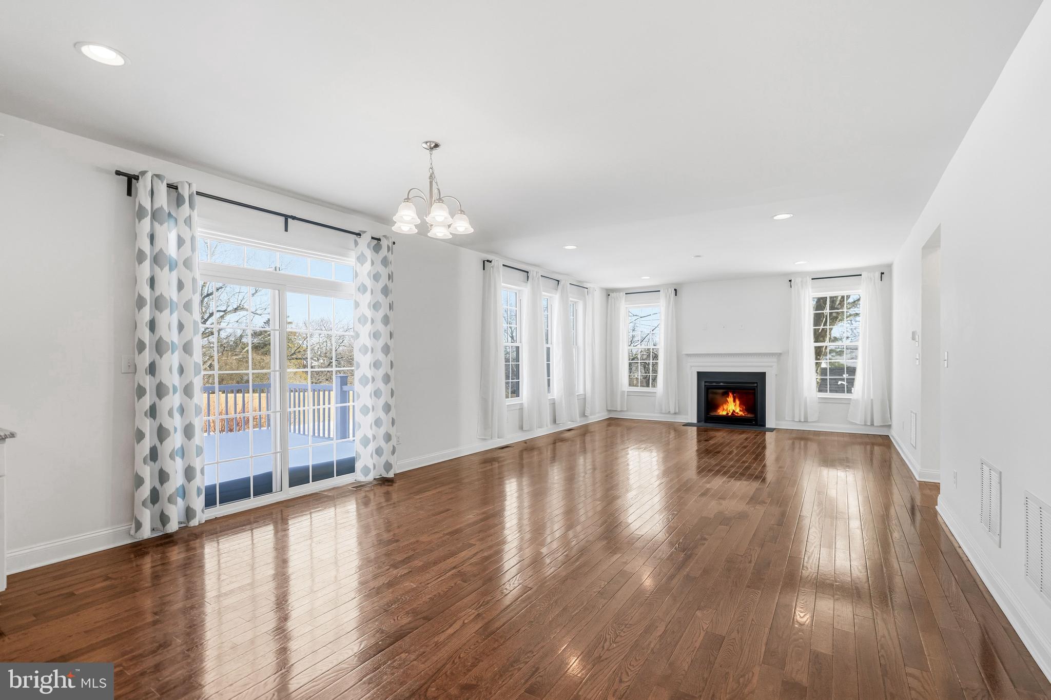 4777 Old Easton Road Doylestown, PA 18902 - Photo 7 of 26 a view of empty room with wooden floor and fireplace