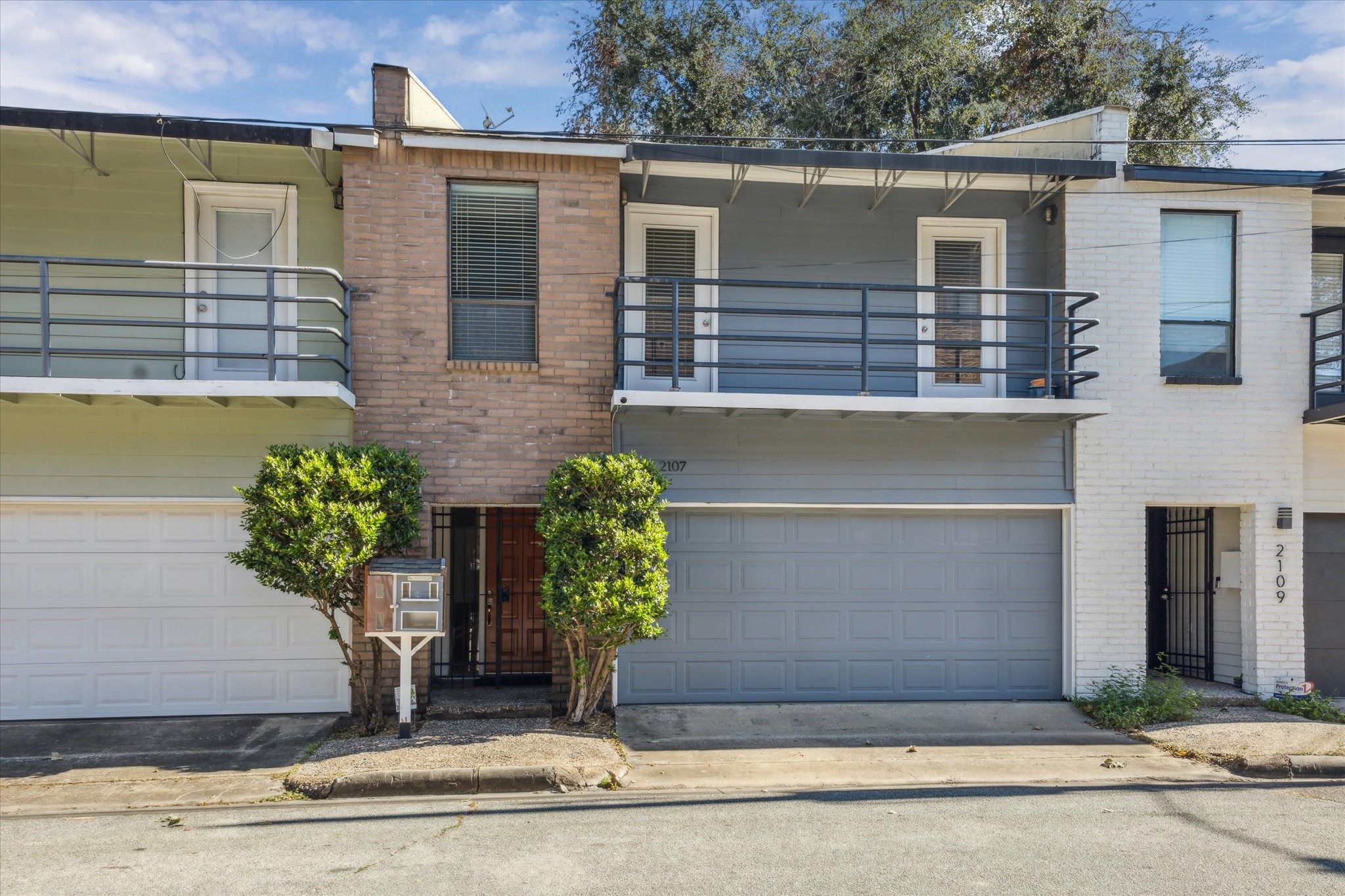 2107 Morgan Street Houston, TX 77006 - Photo 1 of 13 Modern Montrose townhome living with clean lines, second floor balcony, private entry & attached 2-car garage.